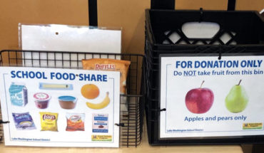 two bins for leftover food at elementary school