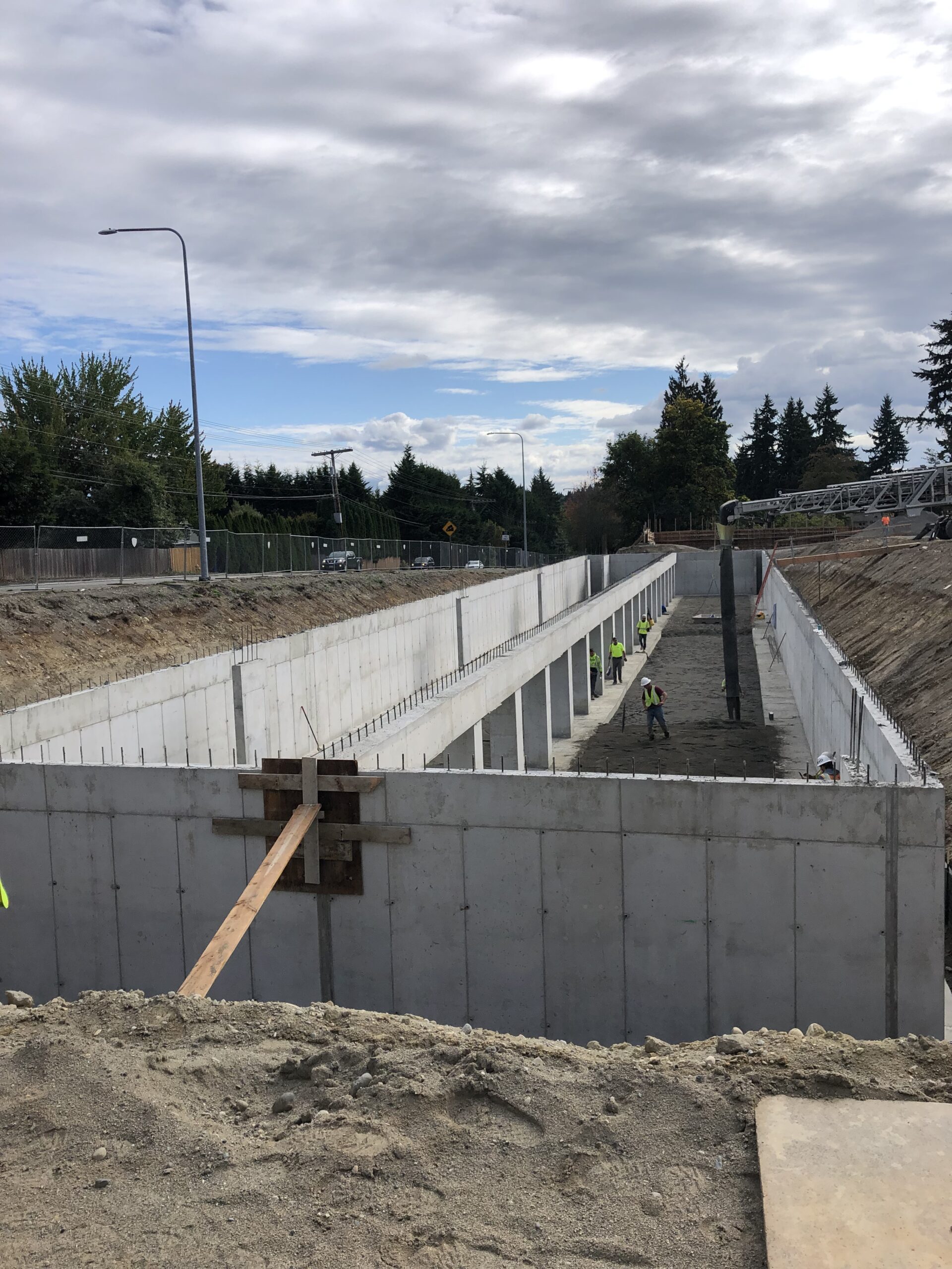 A large concrete structure being installed underground